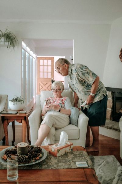 An older couple at home with help